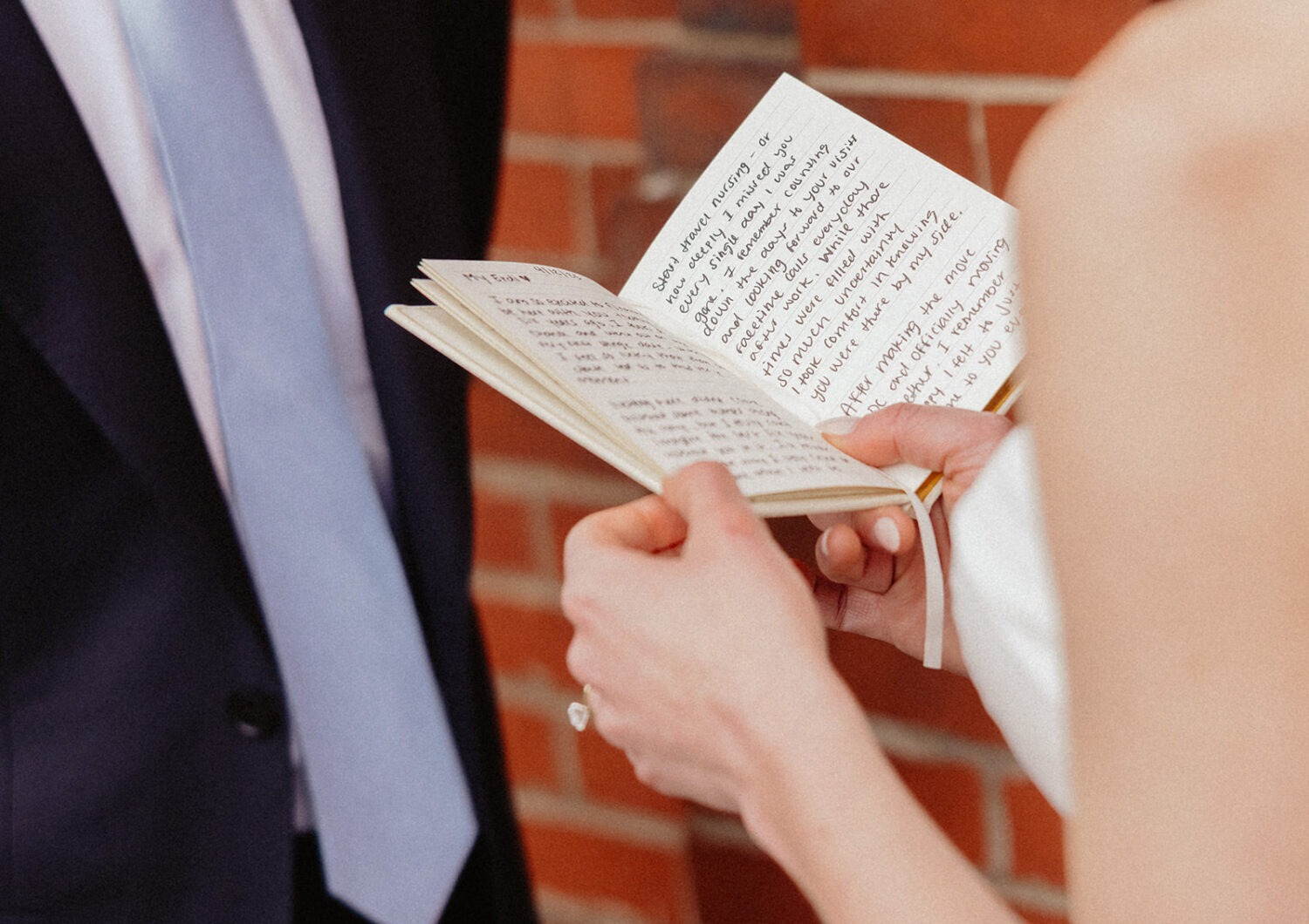 bride and groom reading vows during first look