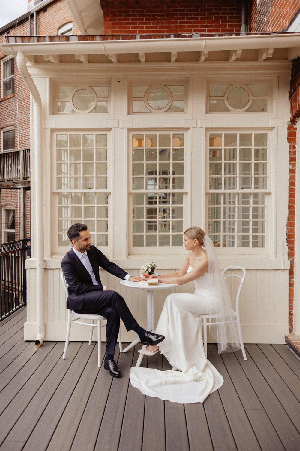 couple sitting at table on upper terrace at Swann House DC