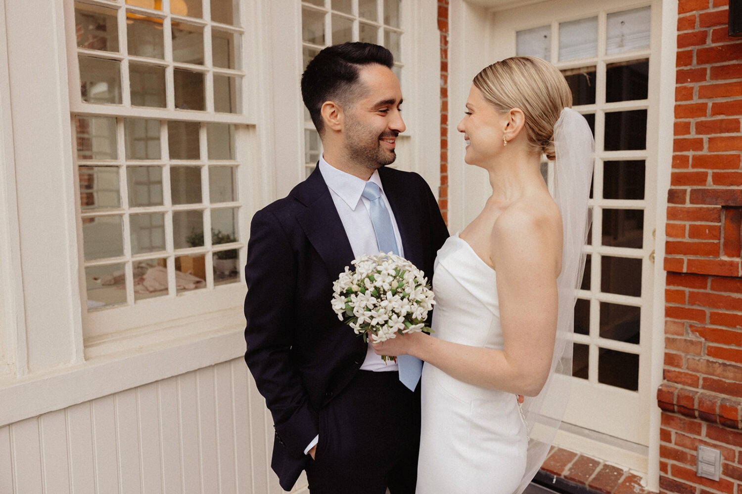 couple embrace on terrace of historic Swann House DC
