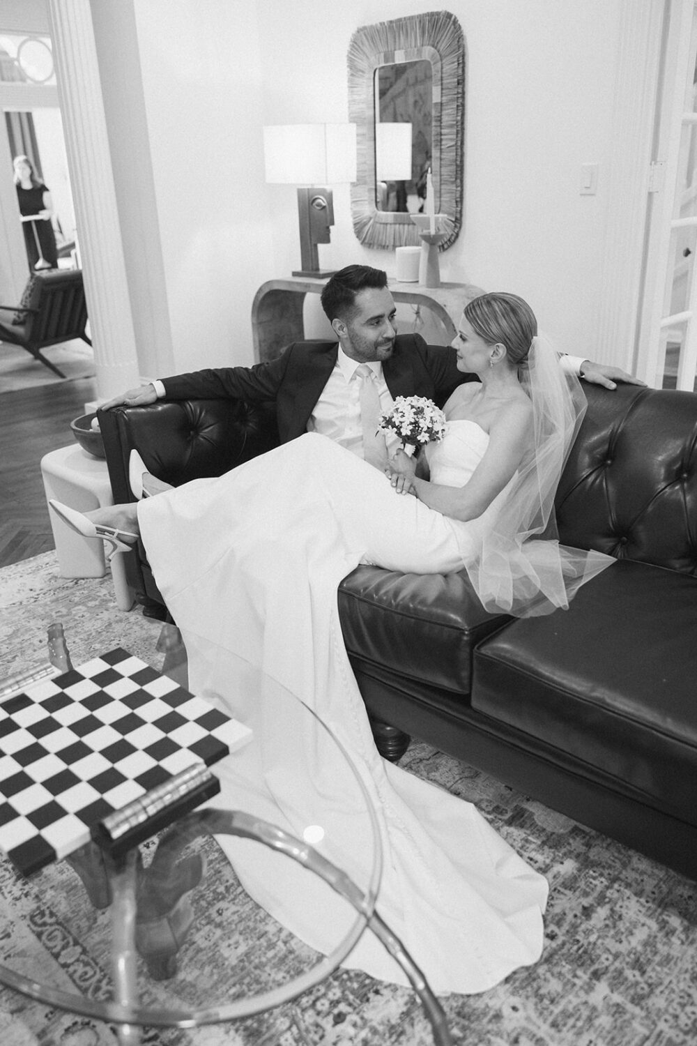 couple poses on couches at Swann House DC