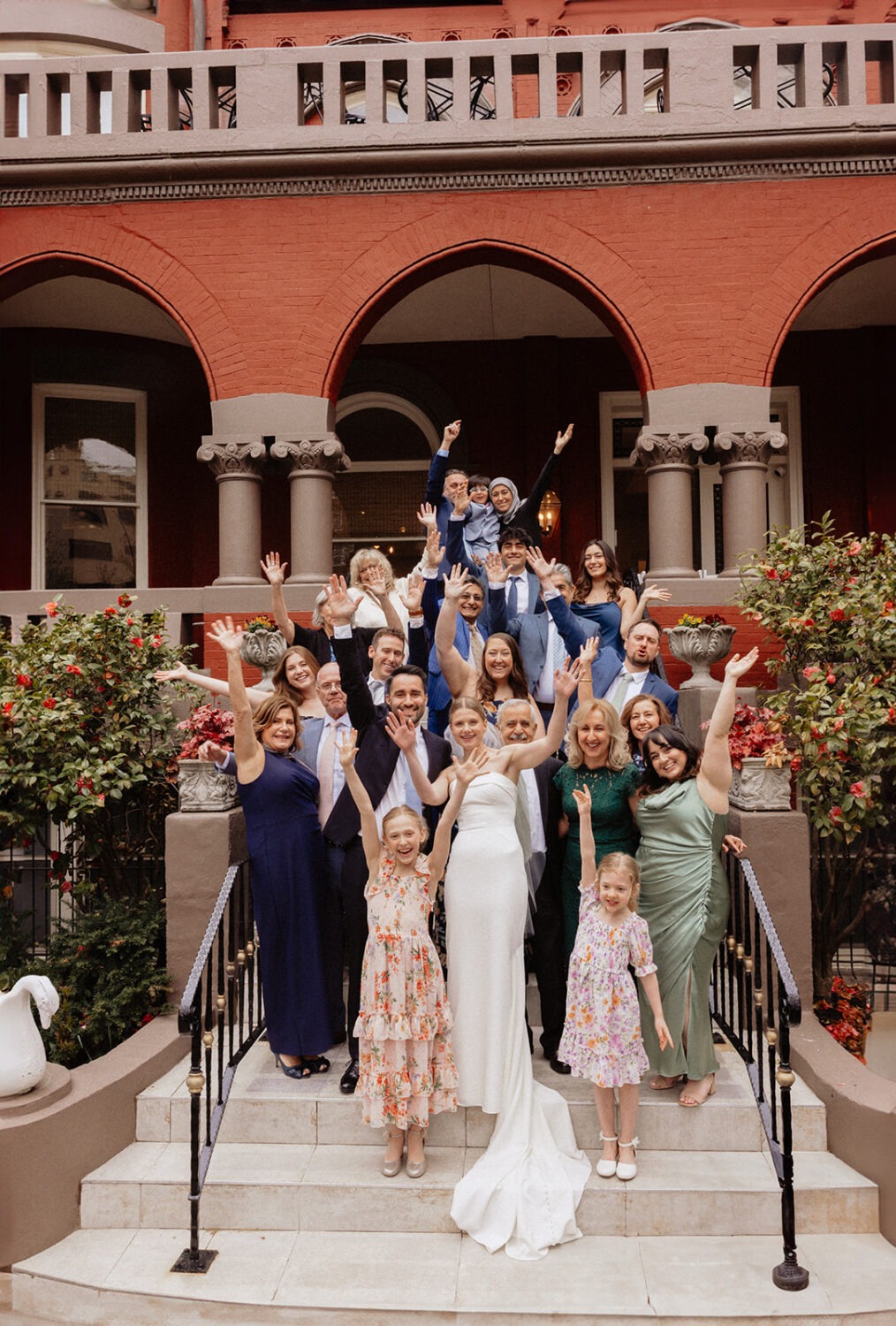 family pose together for group photo on front steps of Swann House DC