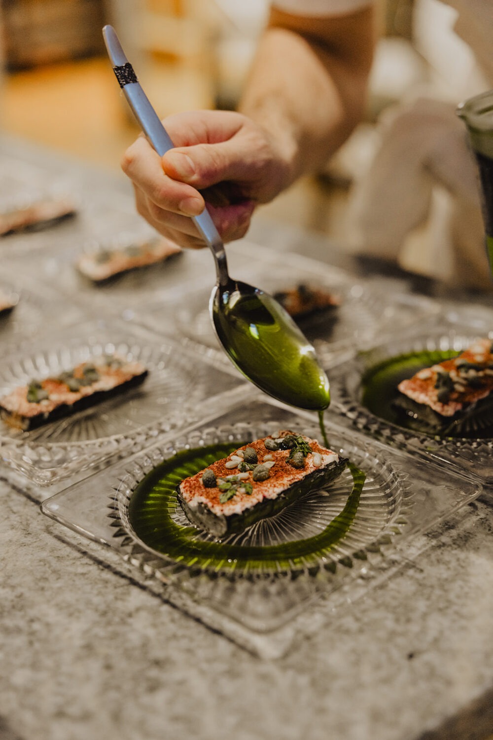 chef plating a gourmet appetizer