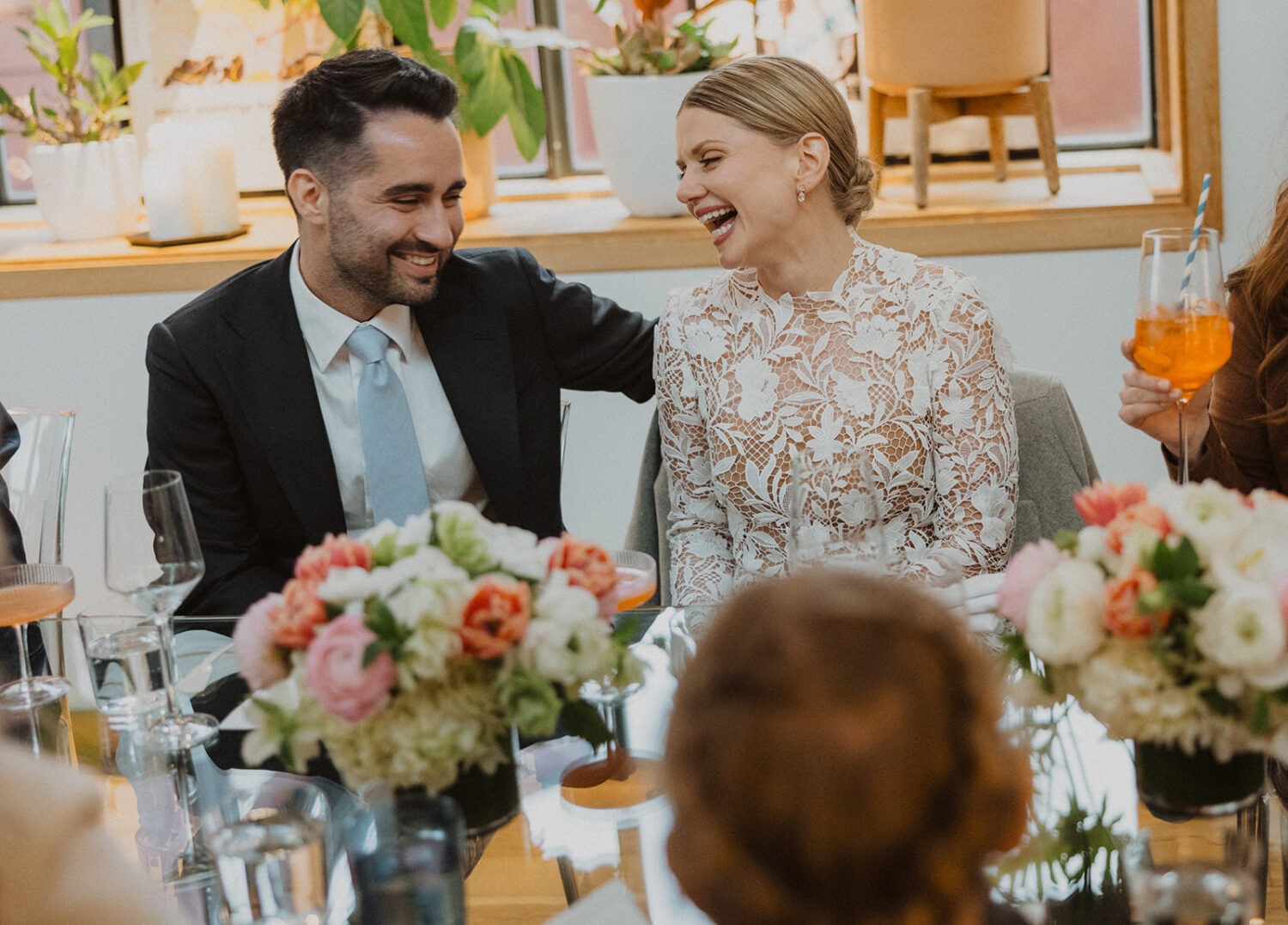 couple laughing together during reception at Rose's Luxury Restaurant