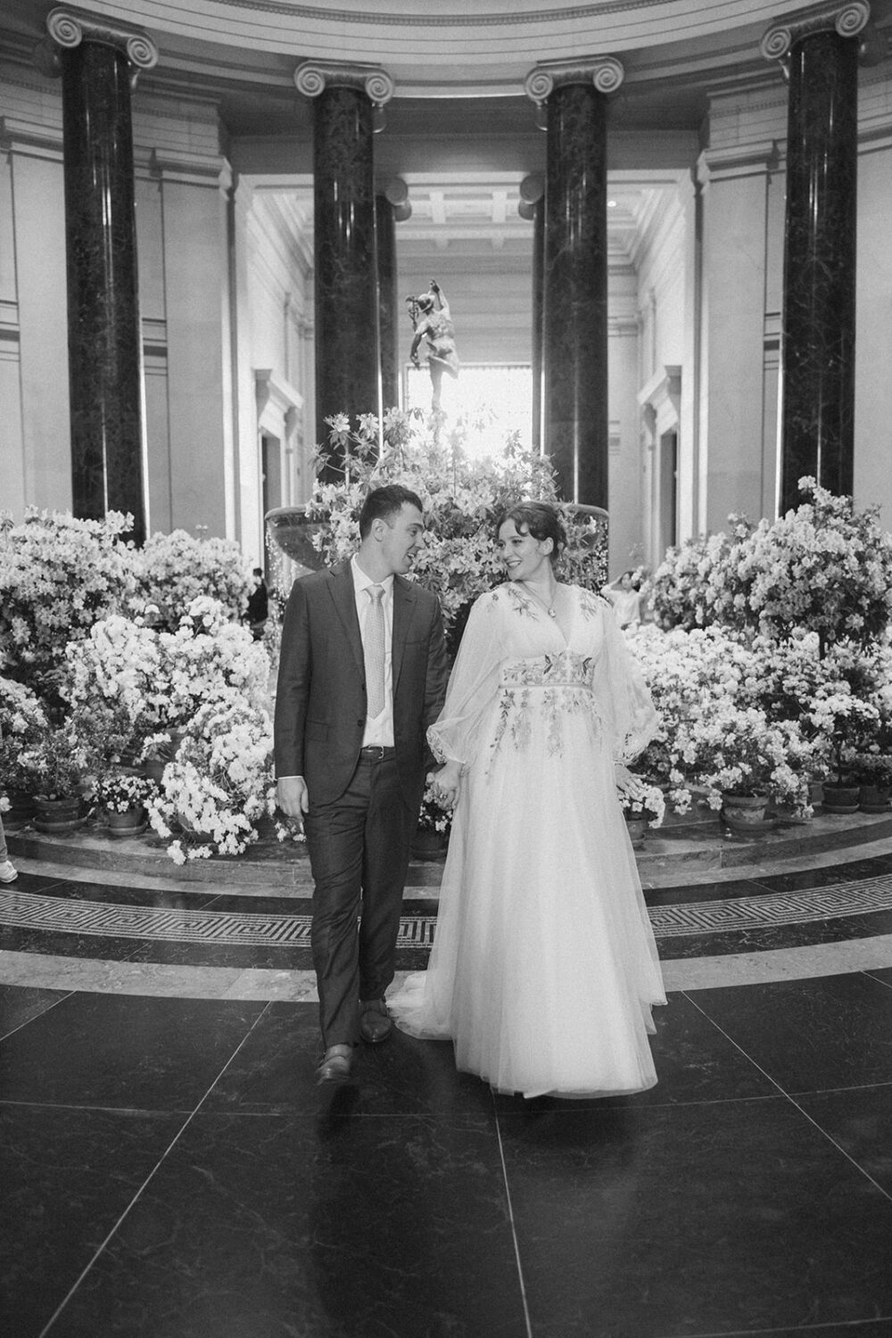 couple poses together in the National Gallery of Art in Washington DC
