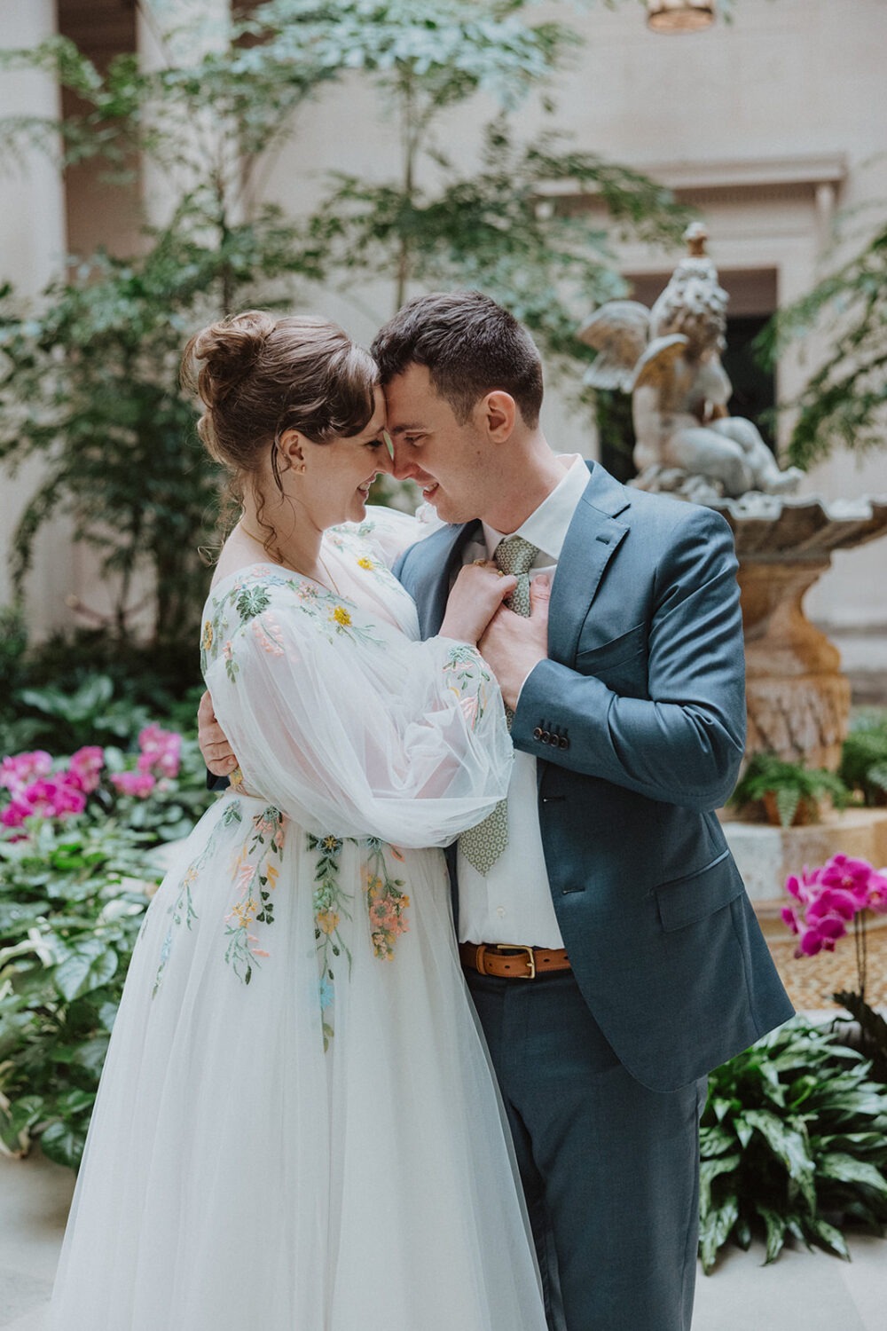 couple poses together in the National Gallery of Art in Washington DC
