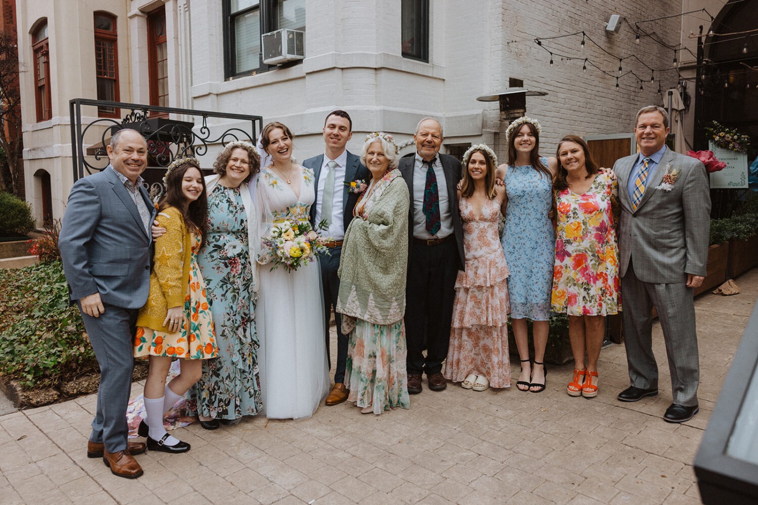 small wedding group photo with the couple and their guests