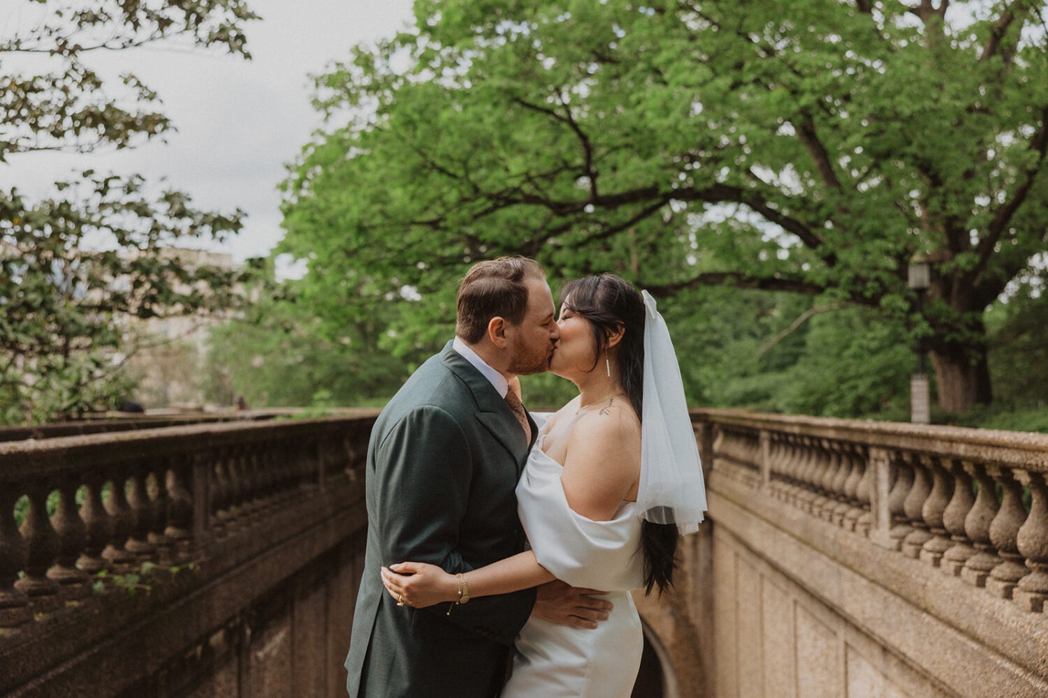 couple kissing along walkway at Meridian Hill Park