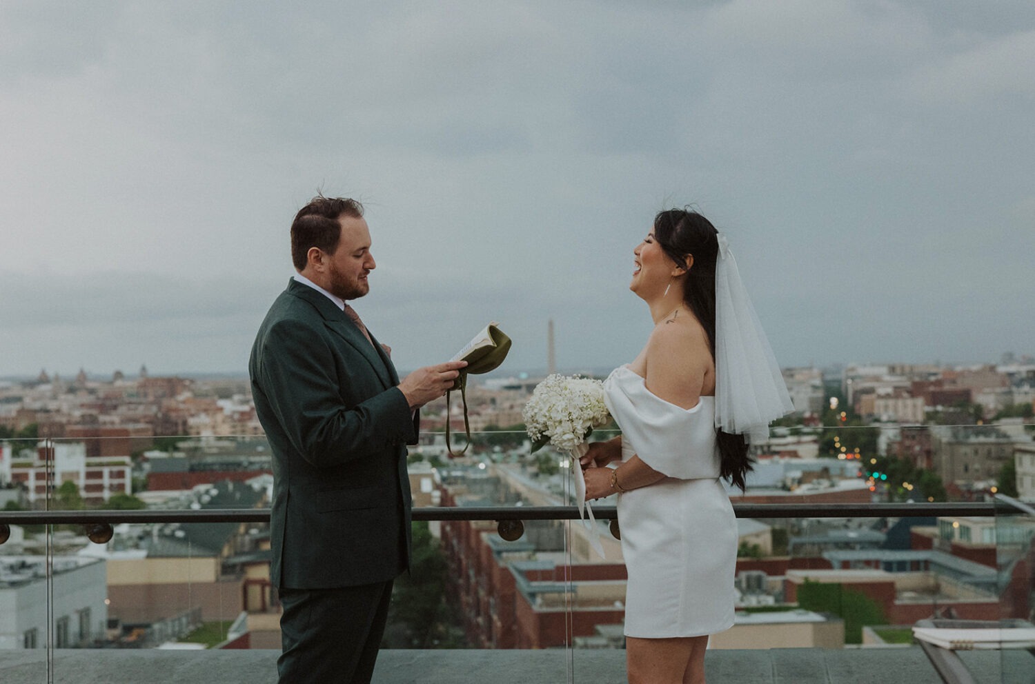 couple reading their vows to each other on the Rooftop of The Line Hotel in Washington DC