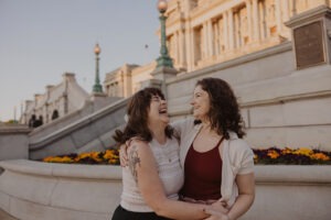 couple laugh and embrace during engagement photoshoot