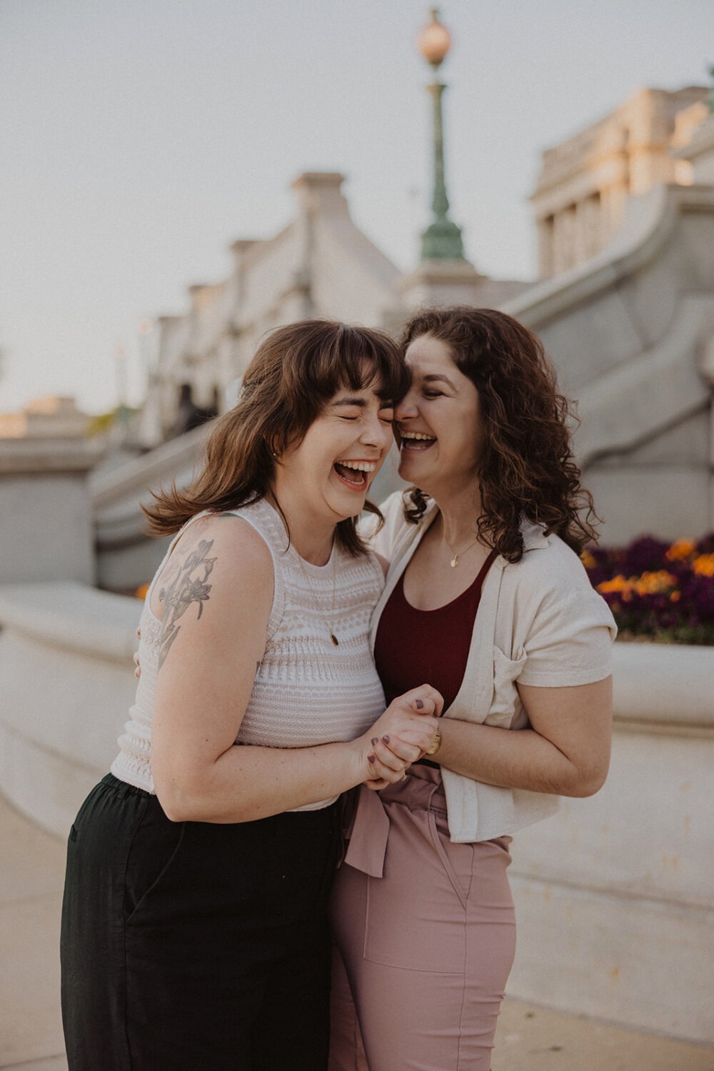 couple laugh and embrace during DC engagement photoshoot