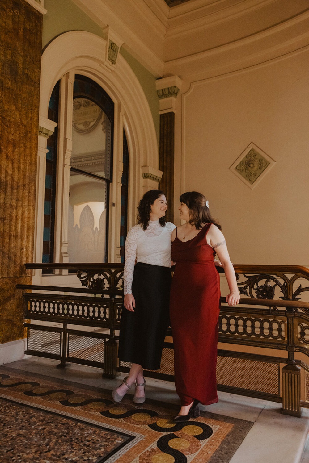 couple pose in the National Portrait Gallery 