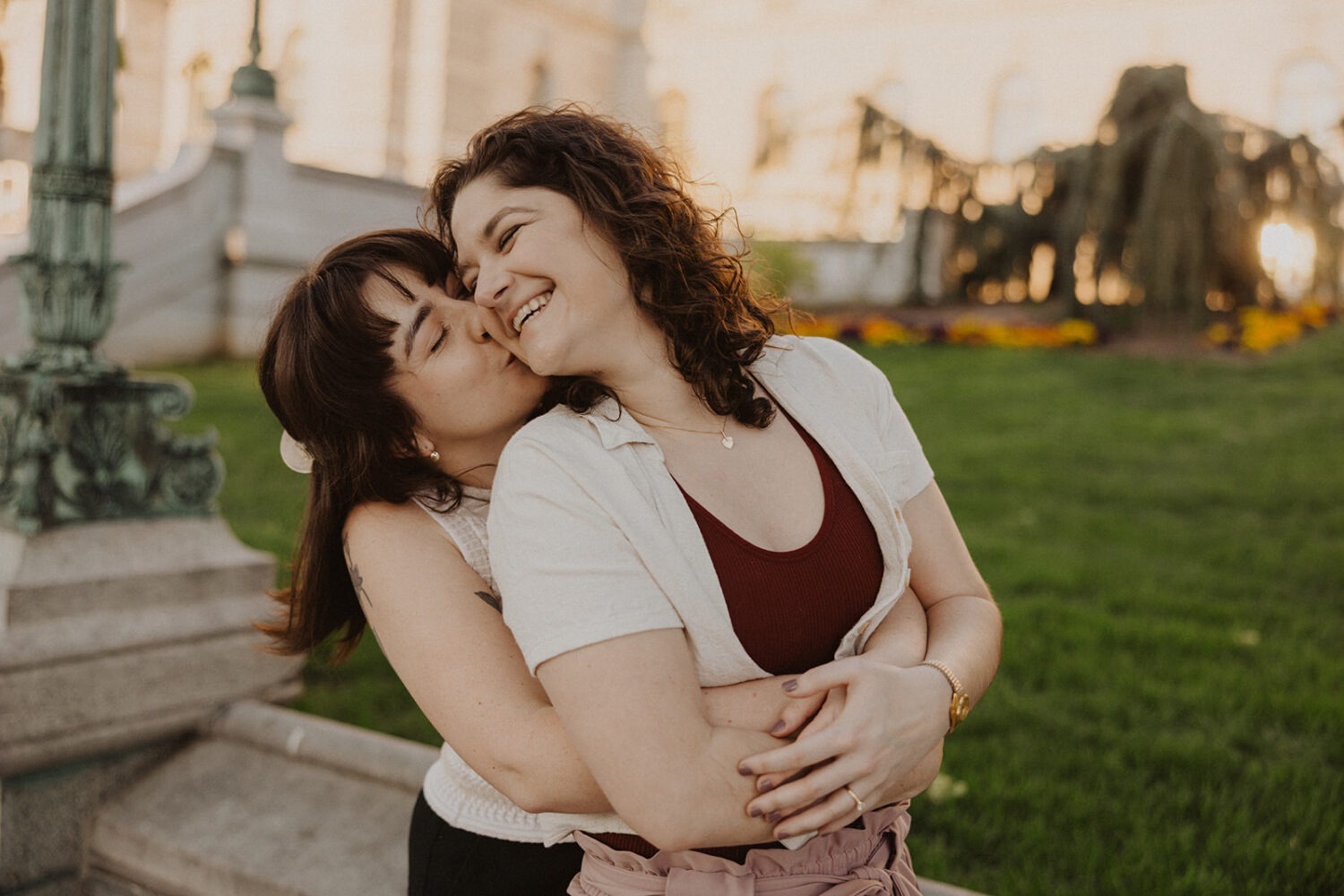 couple kiss and embrace during engagement photoshoot