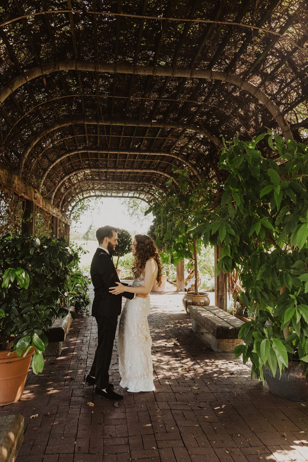 couple embrace after first look at National Arboretum wedding  