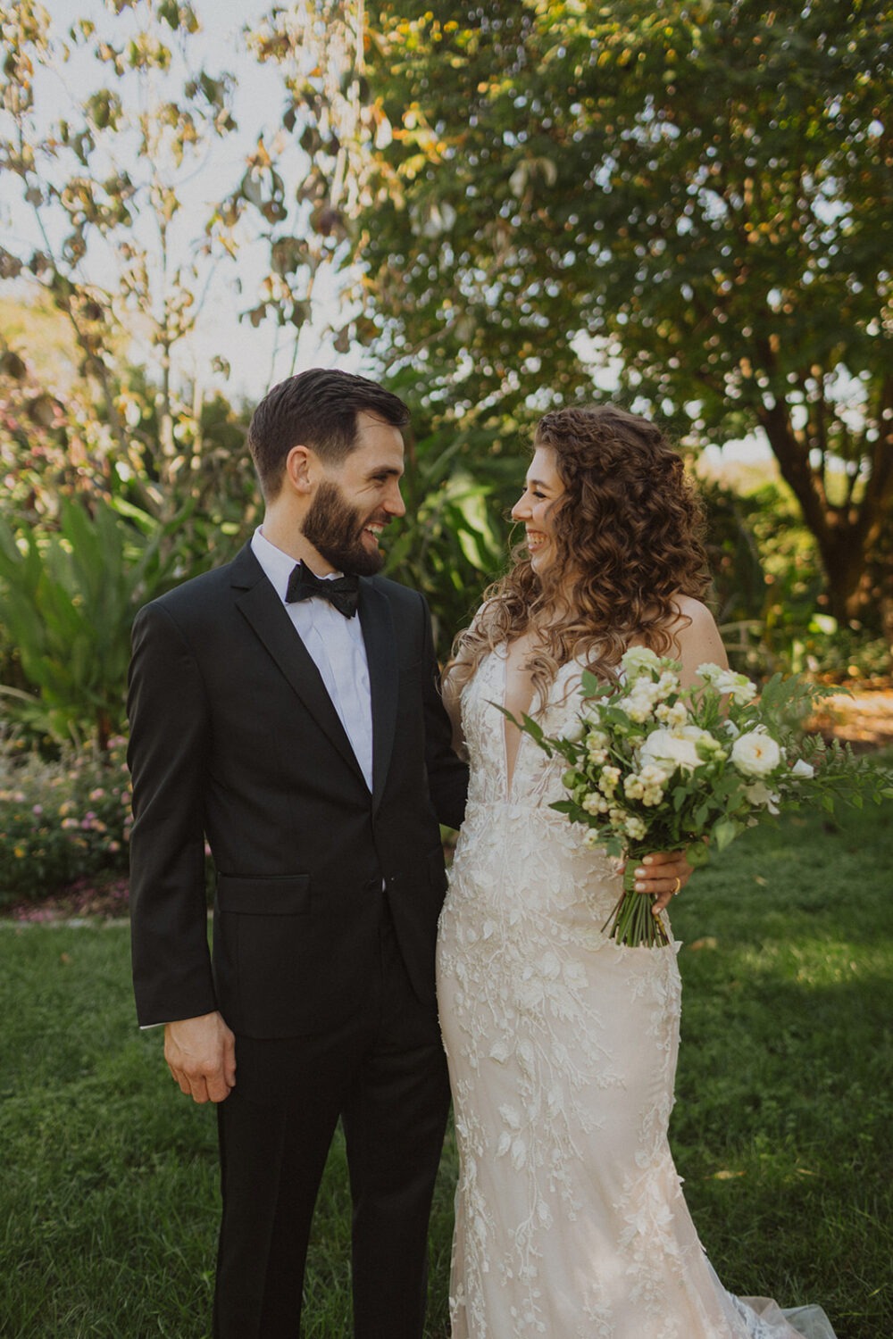 couple pose together along trail