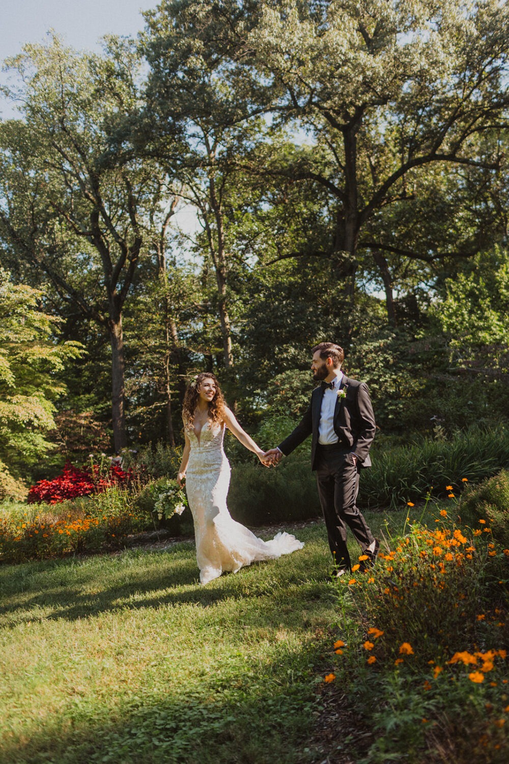 couple walk together holding hands along one of the trails