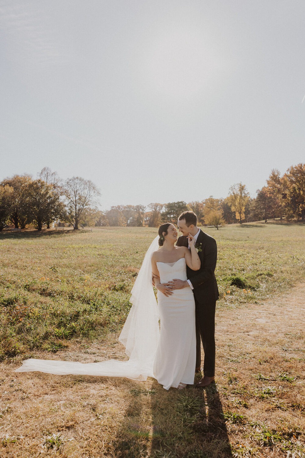 couple pose in Ellipse Meadows during National Arboretum wedding 
