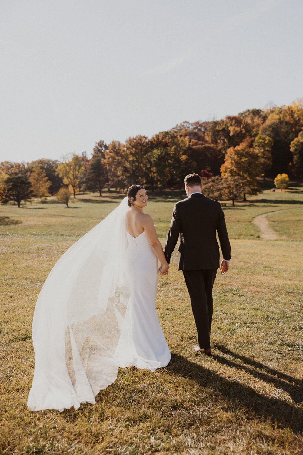 couple pose in Ellipse Meadows during National Arboretum wedding 