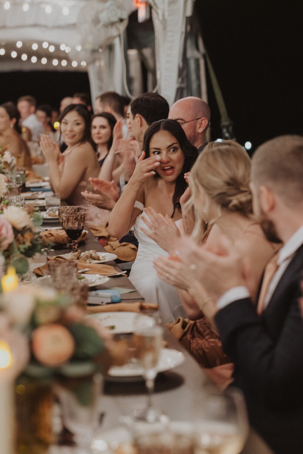 bride wiping tears after speech