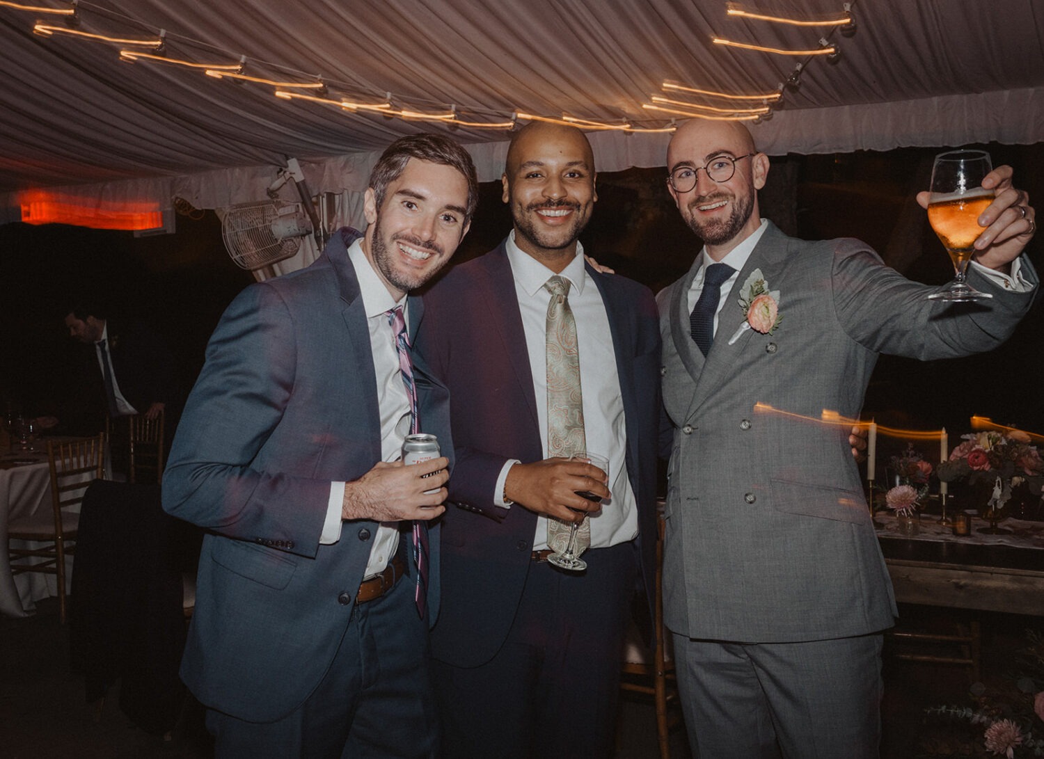 guests pose for photos at reception