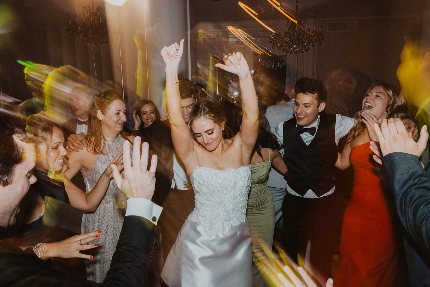bride dances in the middle of guests on the dance floor