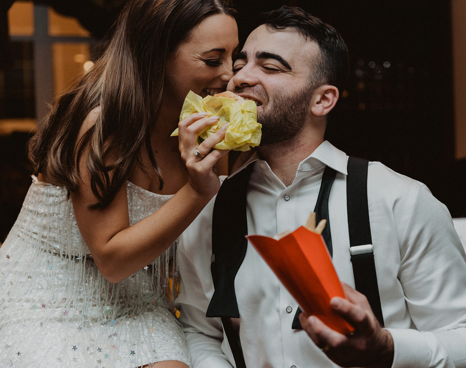couple enjoying McDonalds during after party