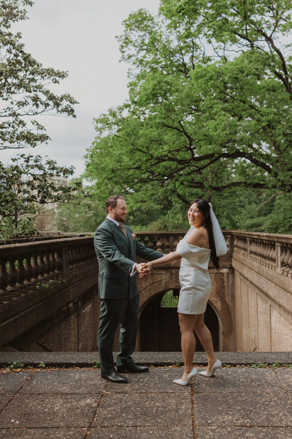 couple pose on top of stairs at Meridian Hill Park