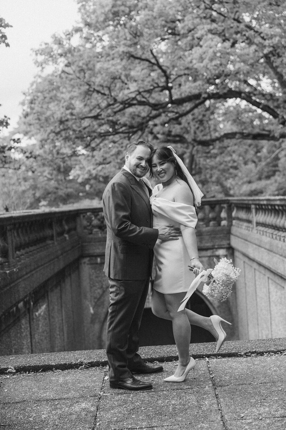 couple pose on top of stairs at Meridian Hill Park