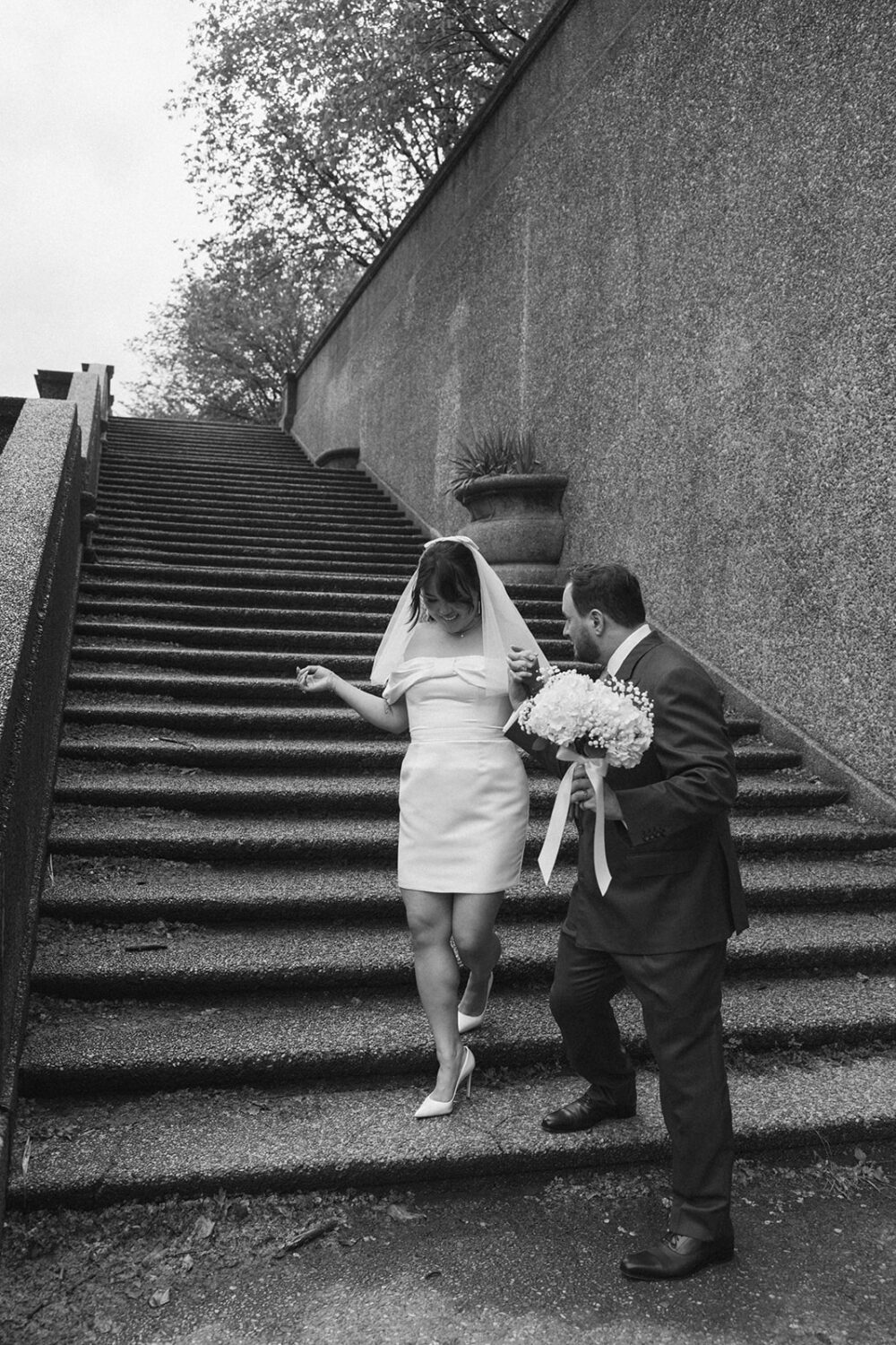 couple walking down stairs in Meridian Hill Park