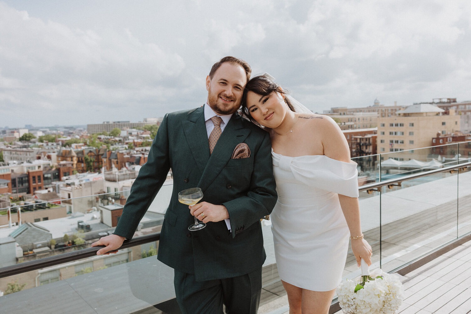 couple pose together on terrace of the Line Hotel