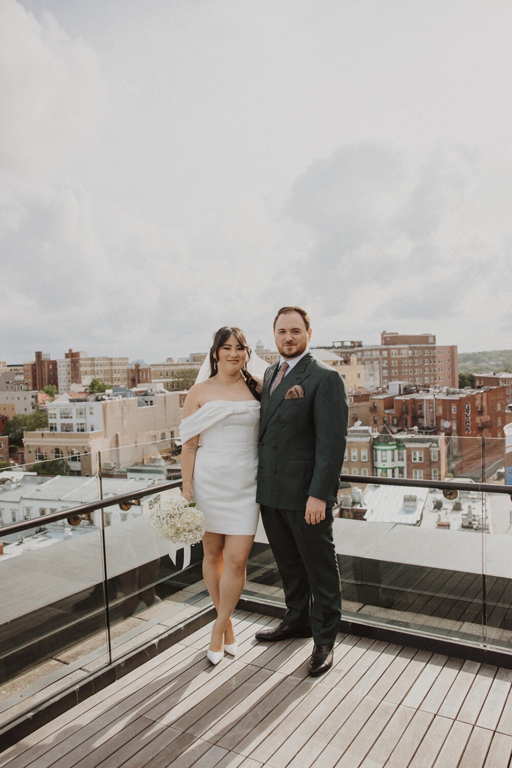 couple pose together on terrace of the Line Hotel