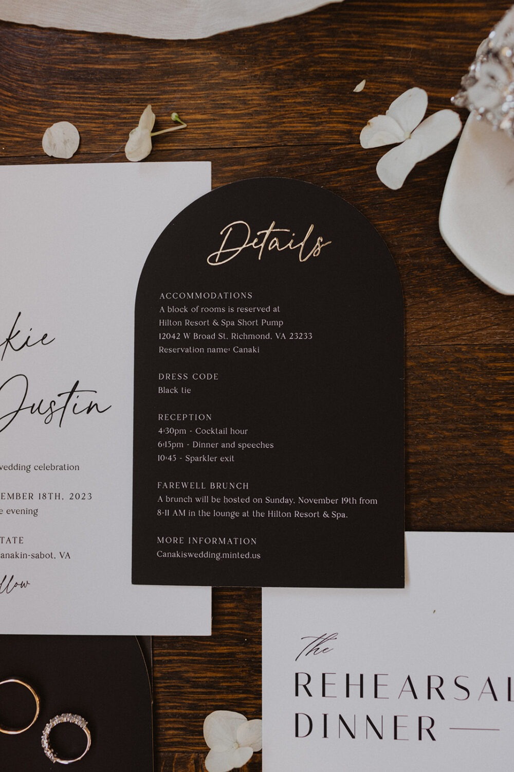 wedding flat lay details with invitation, jewelry, and florals