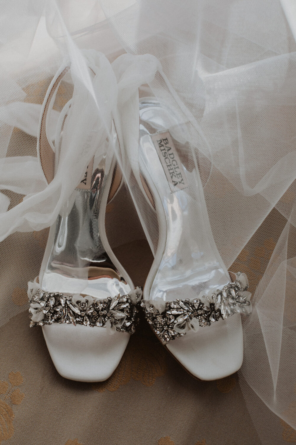 bride's wedding shoes with veil