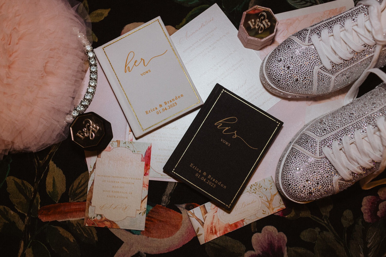 wedding flat lay of dancing shoes, pink purse, vows, rings, etc.