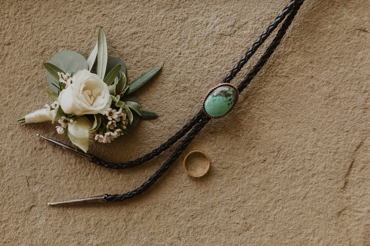 groom's boutonniere, tie, and ring