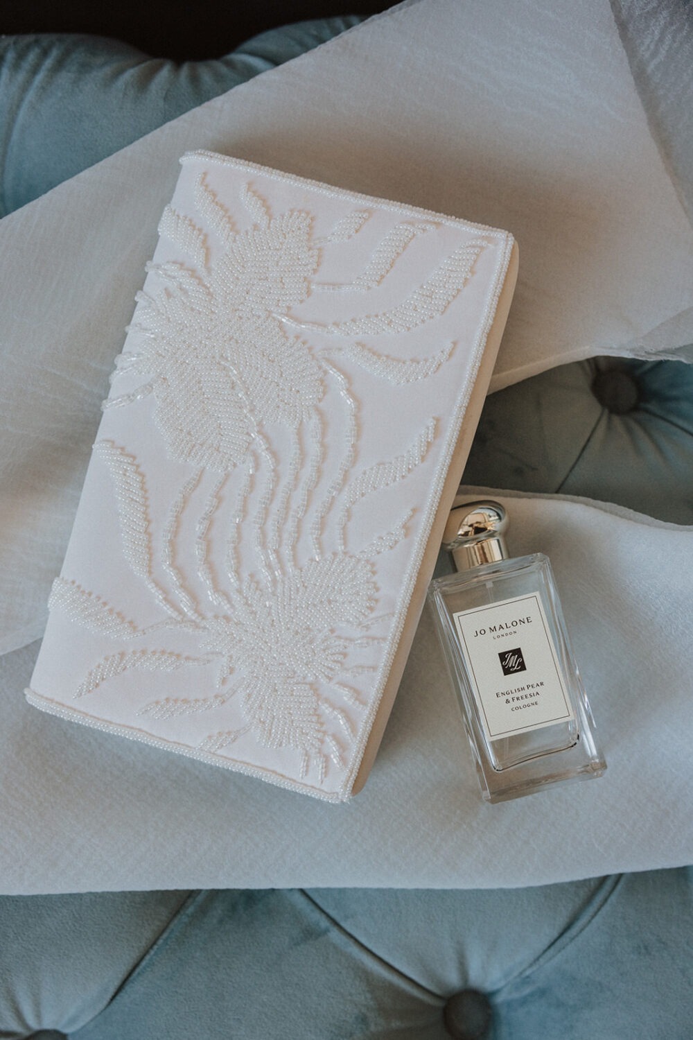 bridal details including vow book and perfume