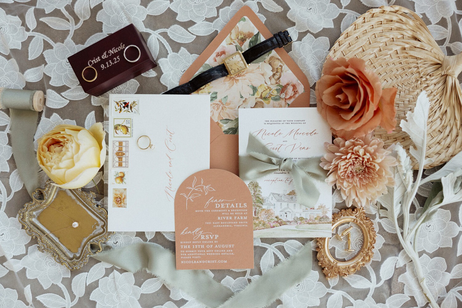 wedding flat lay details with invitation, jewelry, and florals