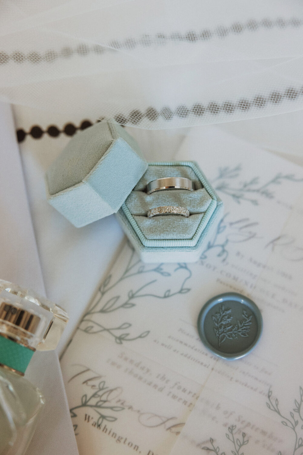wedding details including rings and invitation