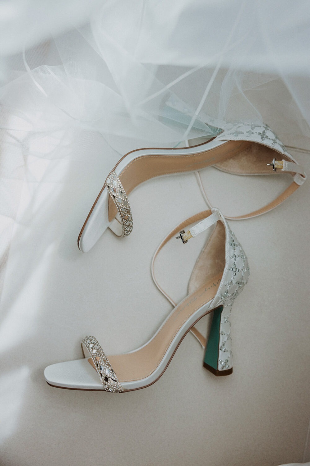 bride's wedding shoes and veil