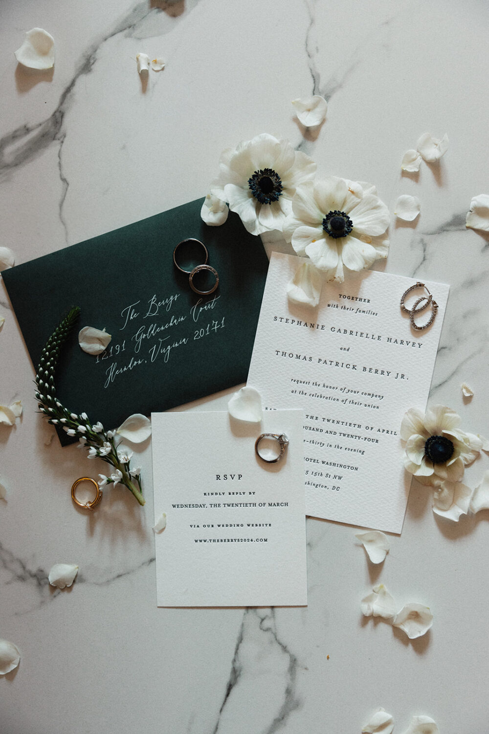 wedding flat lay details of invitation and jewelry