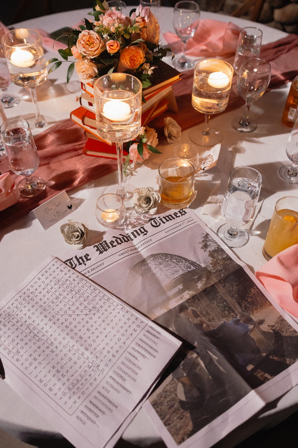 reception flat lay of drinks and crossword puzzle for guests