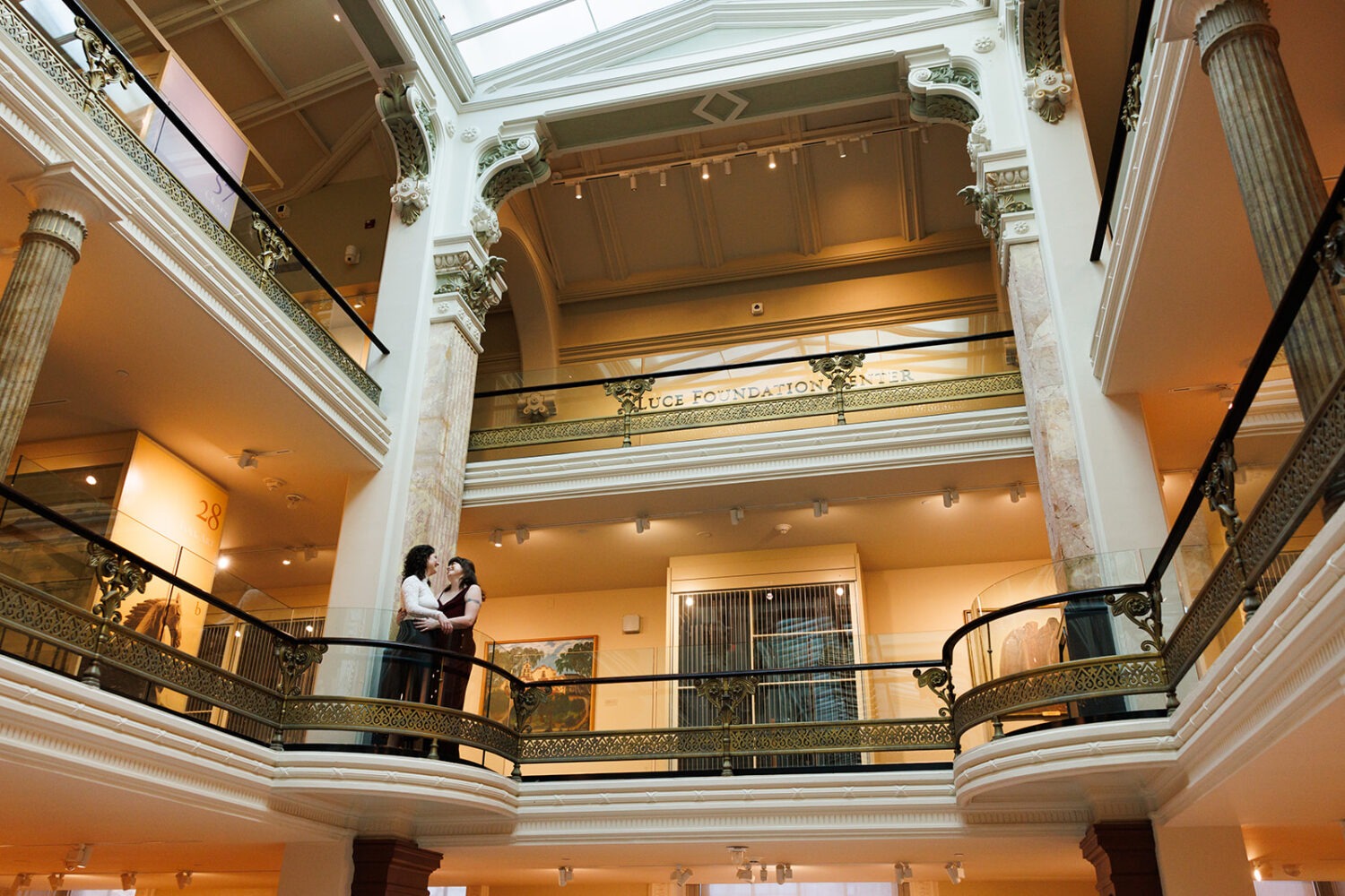 couple embraces in the National Portrait Gallery