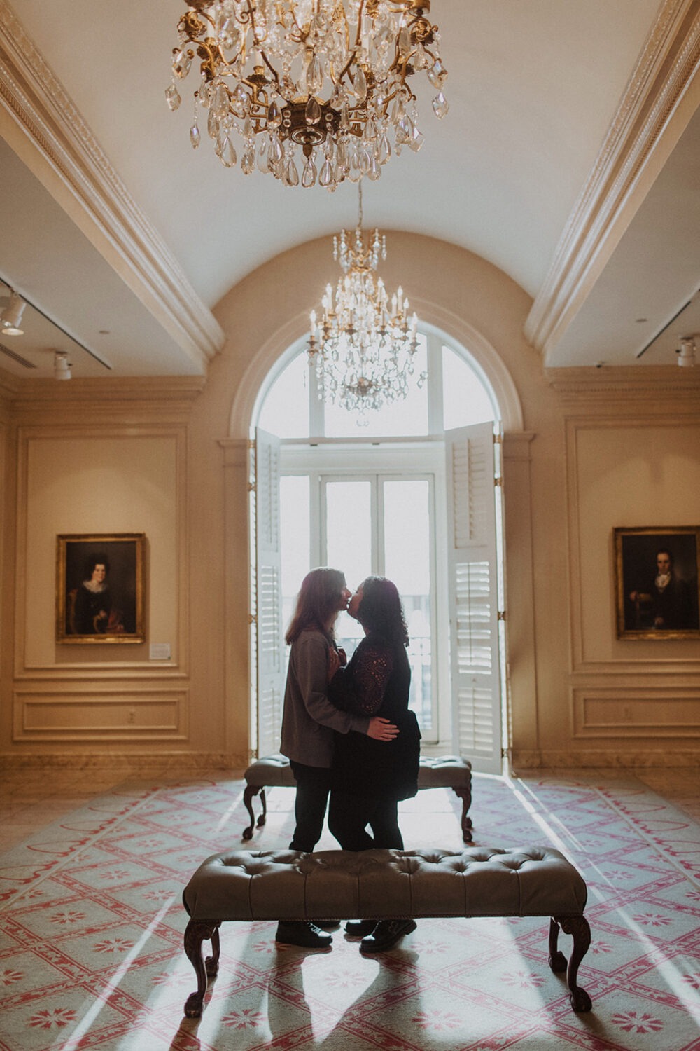 couples photoshoot ideas in front of large windows