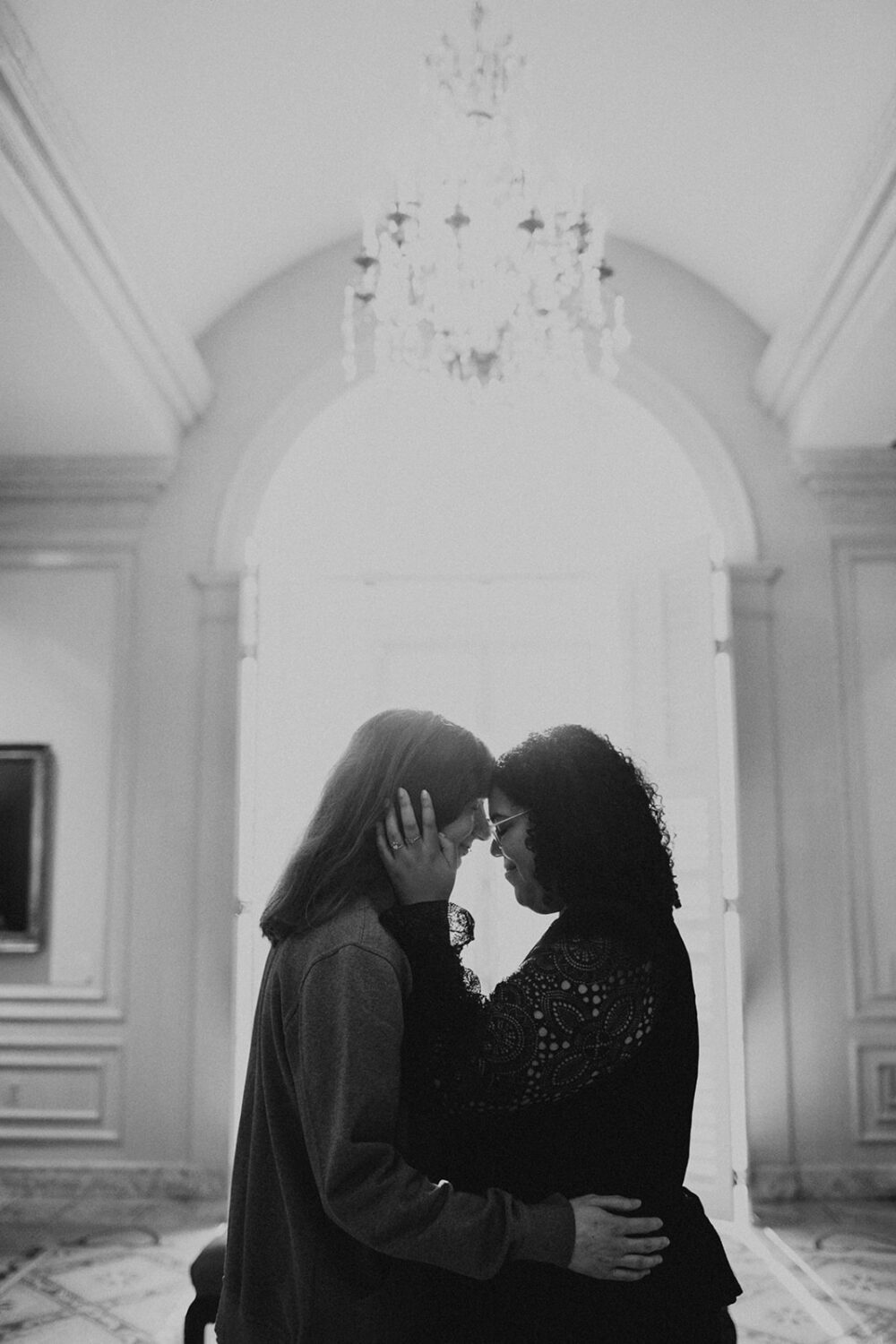 couples photoshoot ideas in front of large windows