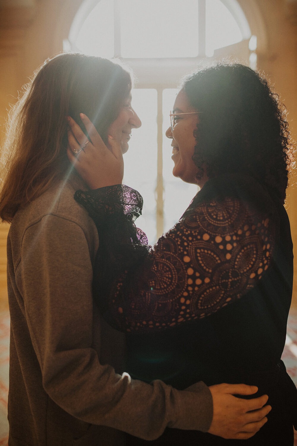 couples photoshoot ideas in front of large windows