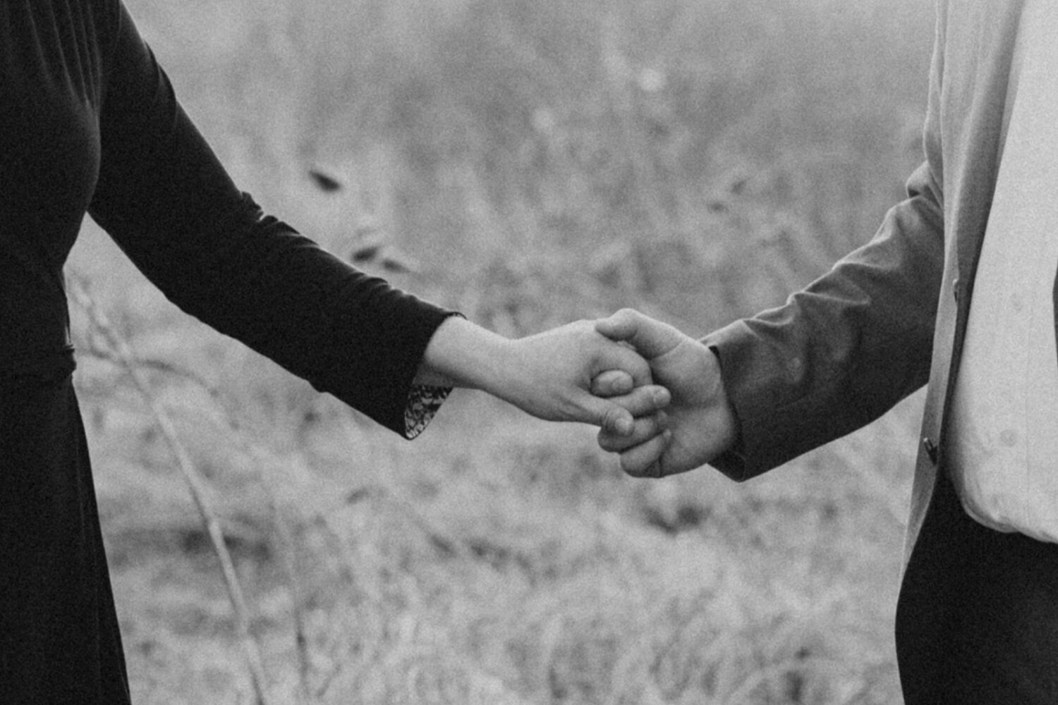 close up shot of couple holding hands
