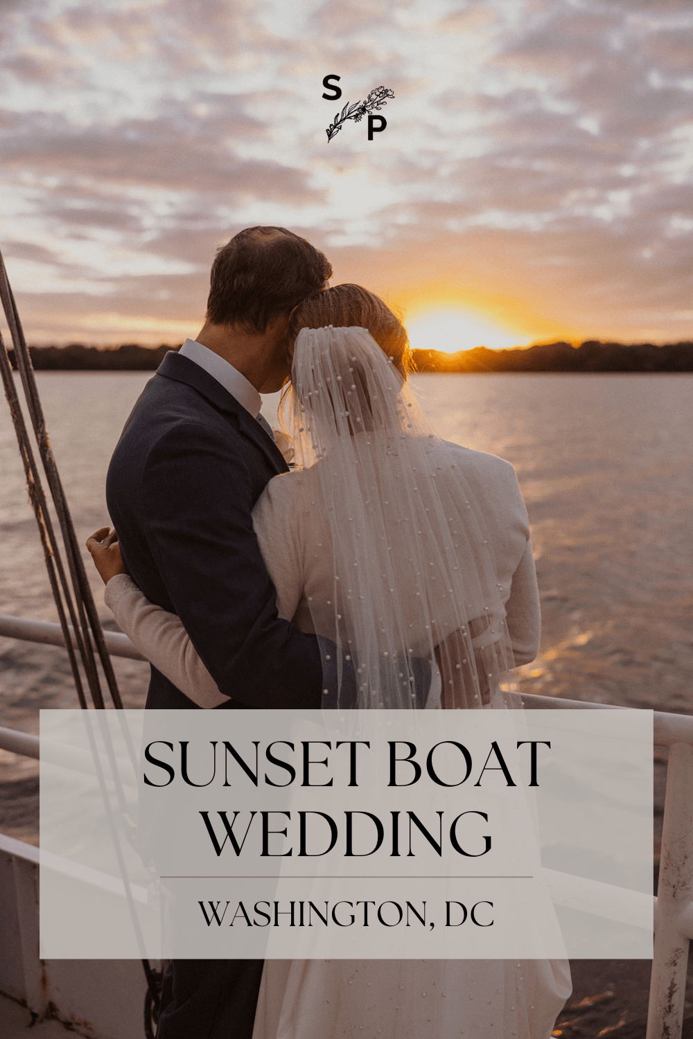 couple pose overlooking the water during sunset boat wedding