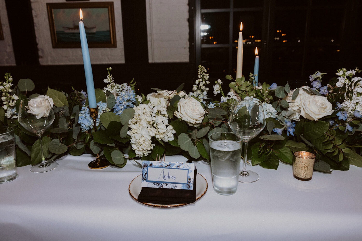 table decorations including blue and white florals and place settings
