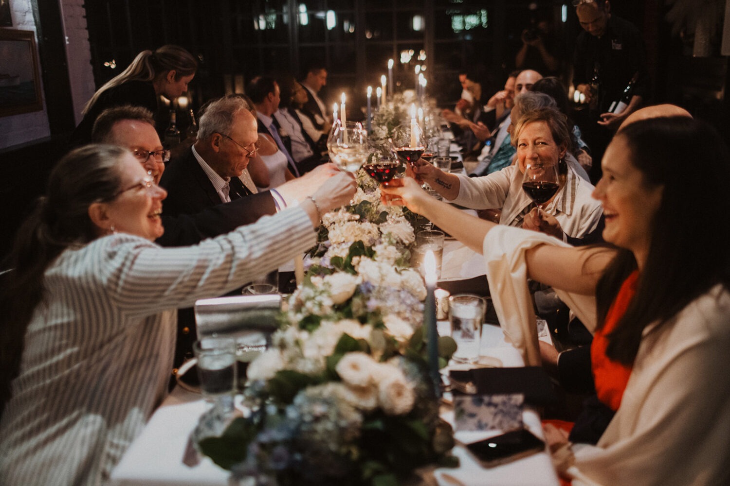 guests participate in toast to the couple at the reception