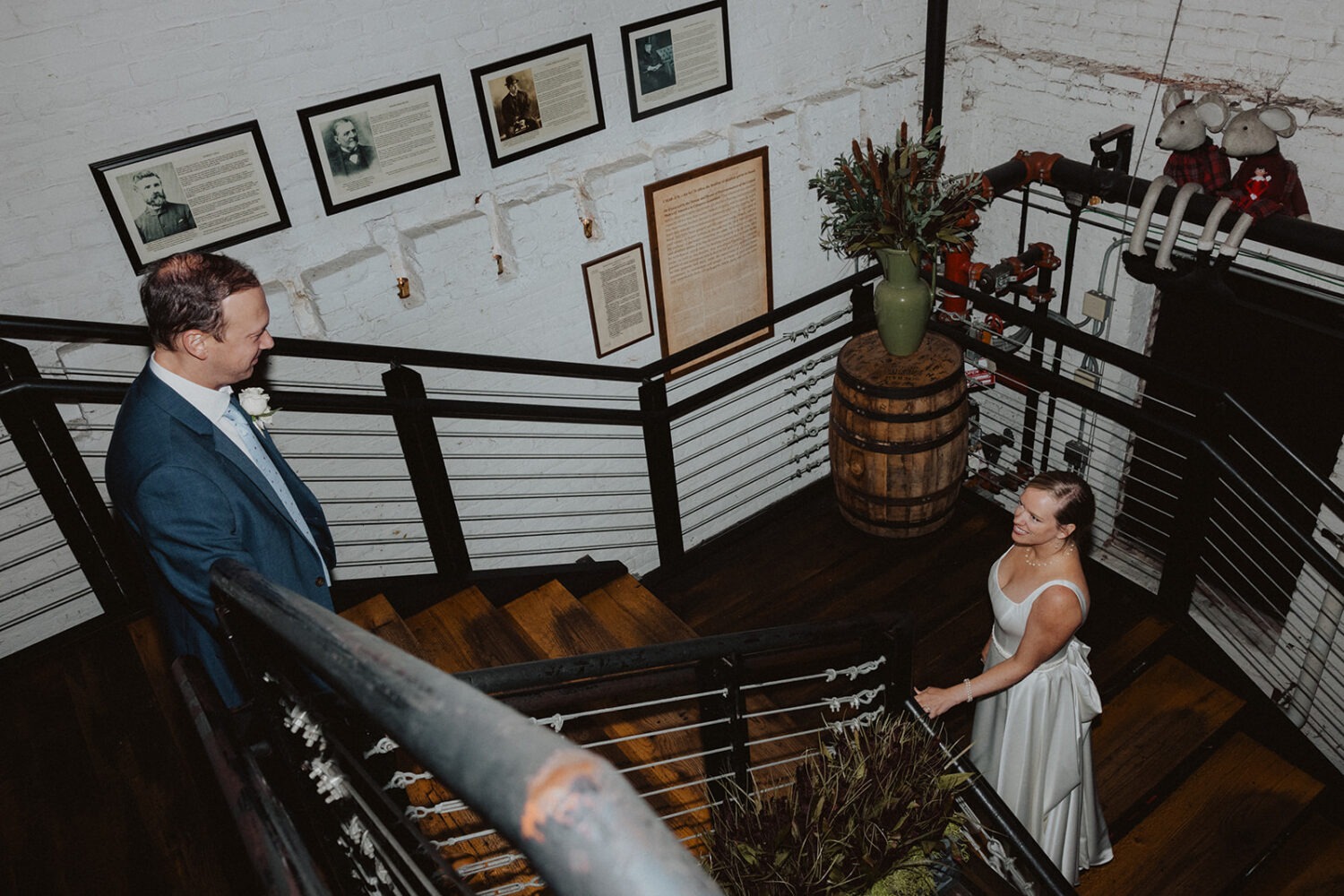 couple posing on the stairs of the Virtue Feed & Grain restaurant