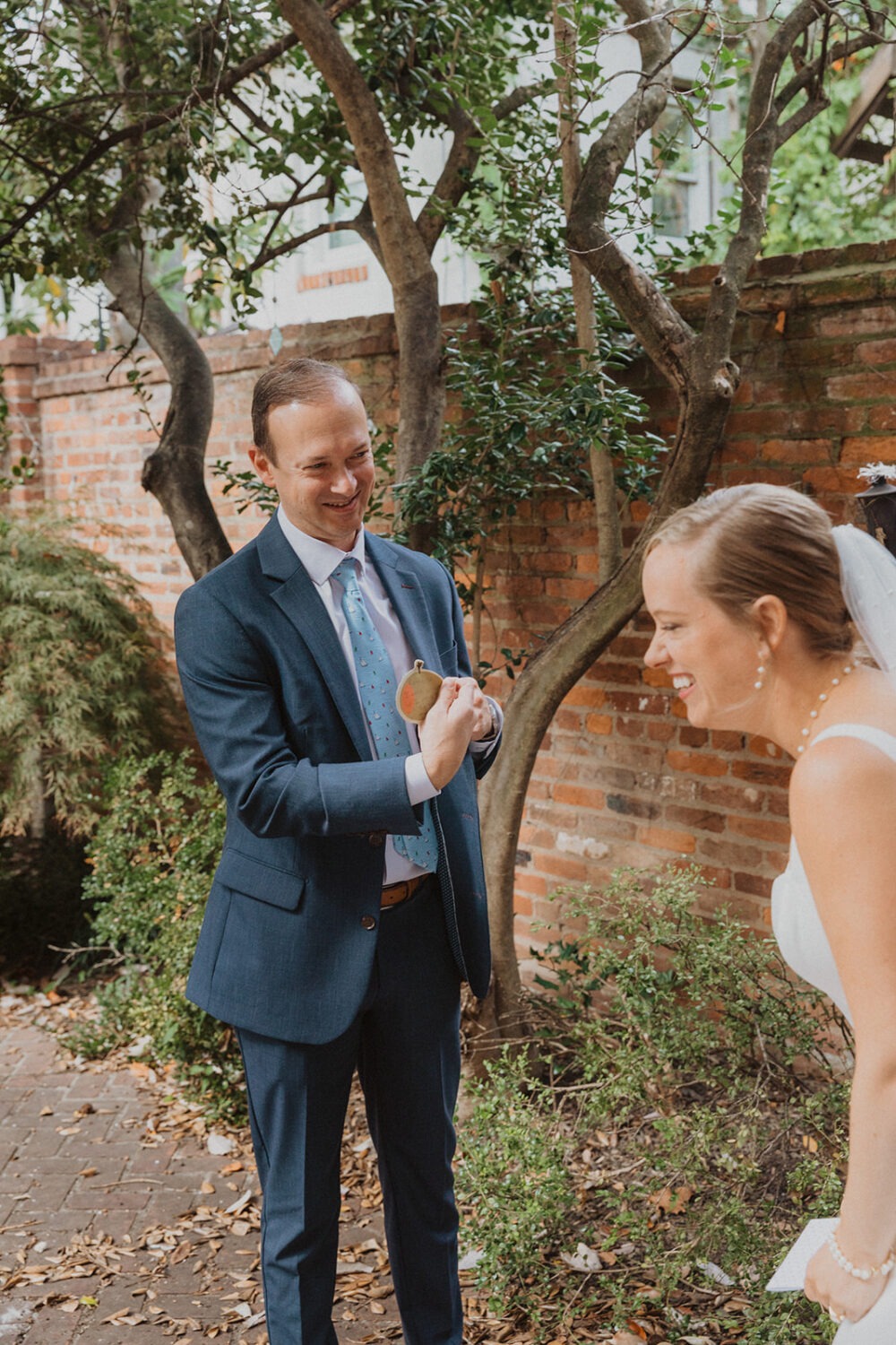 couple laughs together during wedding private vows